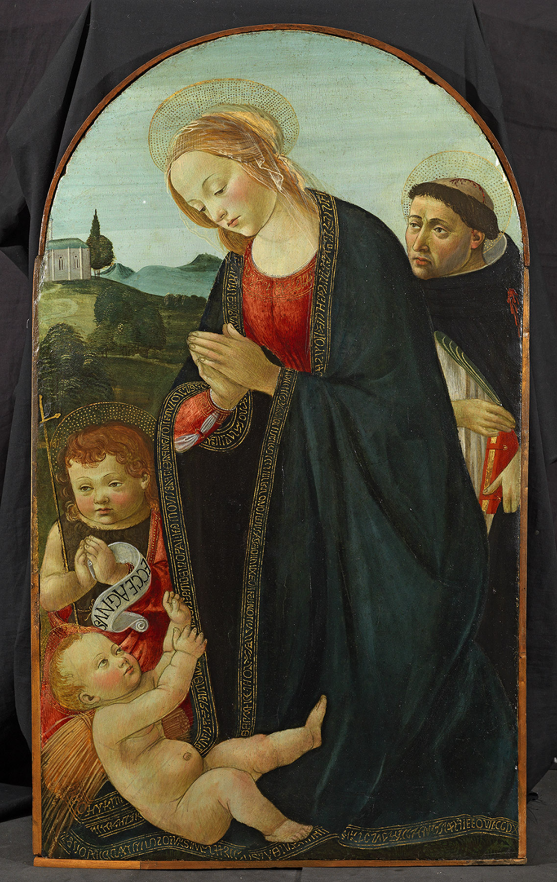 Master of 1493, Madonna Adoring the Child with the Infant Saint John and Saint Peter Martyr, 1490s, panel, 30 x 17 in. (75.8 x 44 cm). The Courtauld, Samuel Courtauld Trust, London, acc. no. P.1966.GP.252